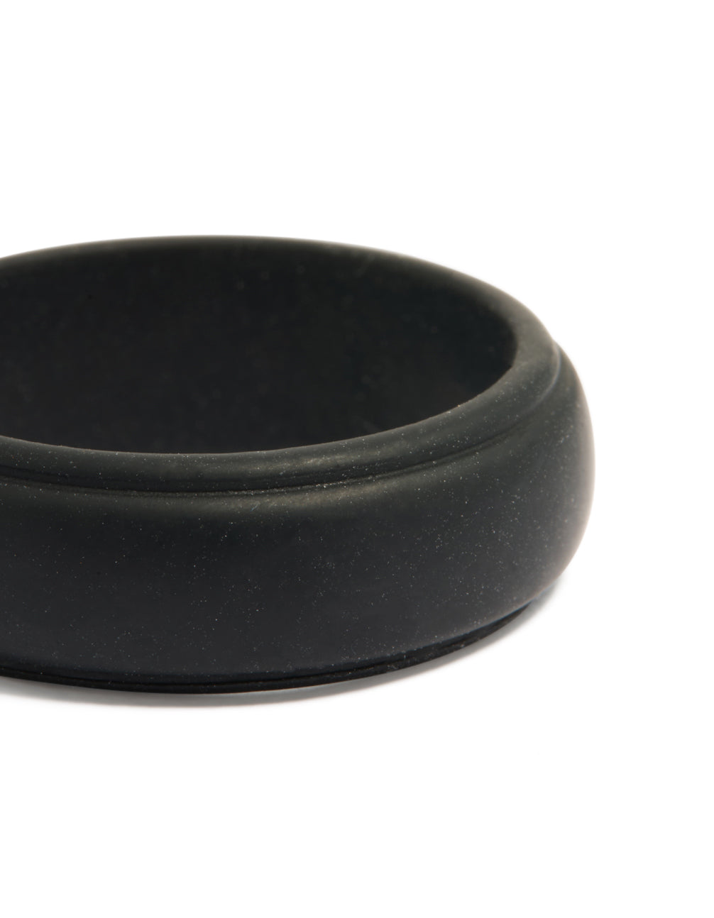 Highlighting a waterproof mens black silicone band ring close up view