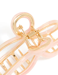Designed with a bow claw clip in solid pink and gold detail view - link has visual effect only