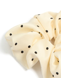 Designed with polka dot pattern in cornsilk and black statement fabric scrunchie detail view - link has visual effect only