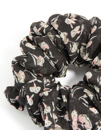 Featuring scattered floral printed statement scrunchie in black, light pink, beige detail view - link has visual effect only
