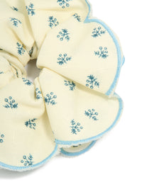 Featuring a ruffled scrunchie with floral print in ivory, sky blue and teal side view - link has visual effect only