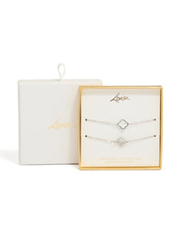 Featuring waterproof stainless steel cubic zirconia flower bracelets in a 2-pack with crystal accents, and silver ivory tones close up view - link has visual effect only
