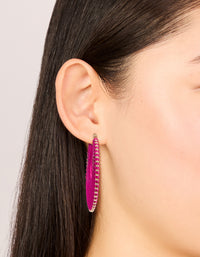 Showcasing hot pink threaded hoop earrings with statement style and gold detailing on ear view - link has visual effect only
