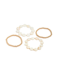 Discover this gold beaded and genuine shell discs bracelets 4-pack in ivory and beige tones featuring ocean-inspired disc design front view - link has visual effect only