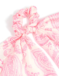 Showcasing a pink boho pattern fabric scarf scrunchie with print in hot pink and misty rose shades detail view - link has visual effect only