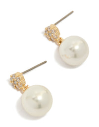 Showcasing gold plated small round cubic zirconia and pearl drop earrings in white front view - link has visual effect only