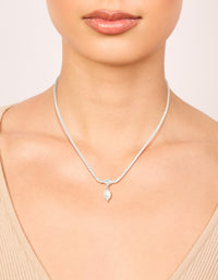 Showcasing a silver plated cubic zirconia and freshwater pearl tennis necklace with on neck view - link has visual effect only