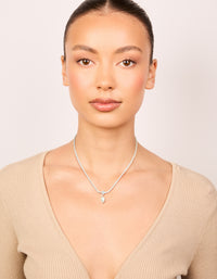 Elegant silver plated cubic zirconia and freshwater pearl tennis necklace featuring on model view - link has visual effect only
