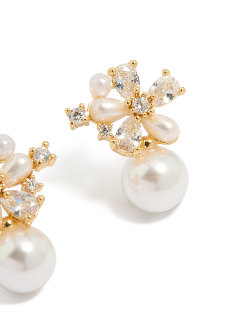 Capturing the floral hoop closure with gold plated cubic zirconia and pearl embellishments in ivory tones post detail view