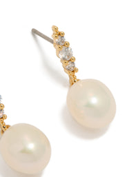 Beautifully crafted statement gold plated cubic zirconia and freshwater pearl drop earrings post detail view - link has visual effect only