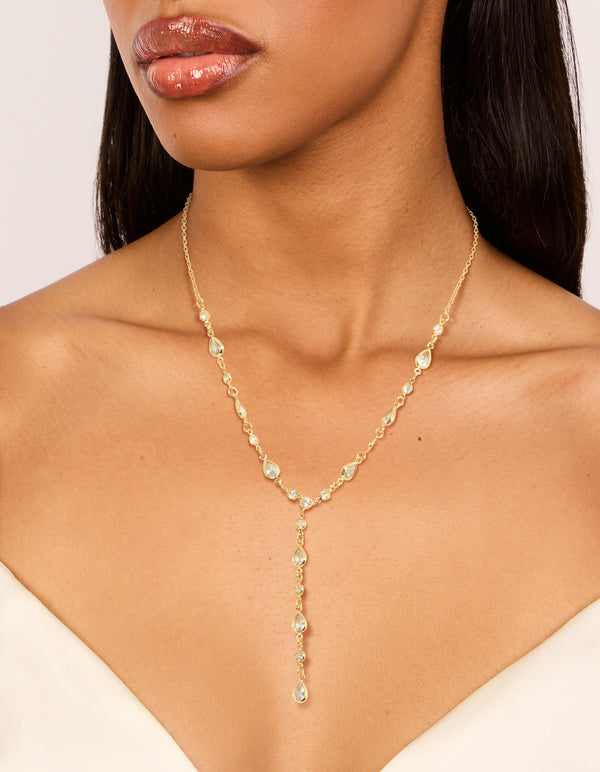 Showcasing a gold plated cubic zirconia alternating Y-necklace with statement style on neck view