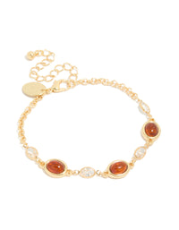 Featuring a gold plated bracelet with cognac beads and clear cubic zirconia in a tennis style front view - link has visual effect only