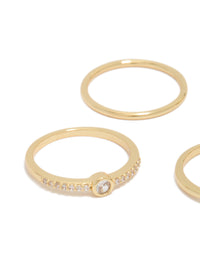Featuring gold plated cubic zirconia wavy bezel set rings 4-pack highlighting stone settings and band details close up view - link has visual effect only