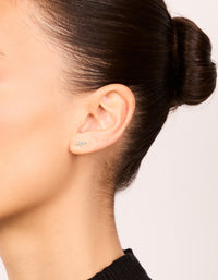 Waterproof stainless steel textured cubic zirconia trio flat back studs in silver and clear on ear view - link has visual effect only