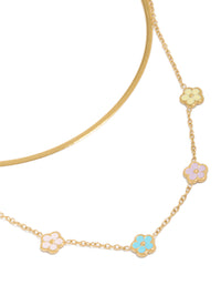 Showcasing a waterproof snake chain layered necklace with floral charm in gold plated stainless steel close up view - link has visual effect only