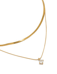 Beautifully styled waterproof layered necklace featuring a snake chain, round cubic zirconia, and a dainty gold plated stainless steel design, on neck view - link has visual effect only