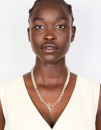 Featuring a waterproof stainless steel long curb chain toggle necklace designed with silver plated material in statement style on model view - link has visual effect only