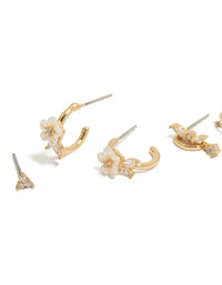 Featuring gold plated cubic zirconia flower and half butterfly earrings in dainty huggie style with crystal close up view - link has visual effect only