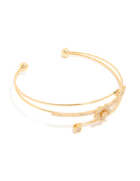 Elegant gold plated cubic zirconia flower wrist cuff featuring with crystal embellishments in gold front view - link has visual effect only