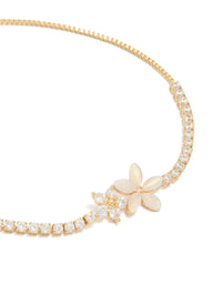 Showcasing the gold plated cubic zirconia flower toggle bracelet featuring intricate floral design close up view - link has visual effect only