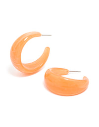 Showcasing statement orange acrylic hoop earrings with gold stud closure front view - link has visual effect only