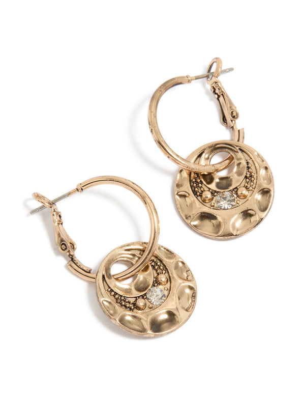 Showcasing gold round disc huggie earrings front view