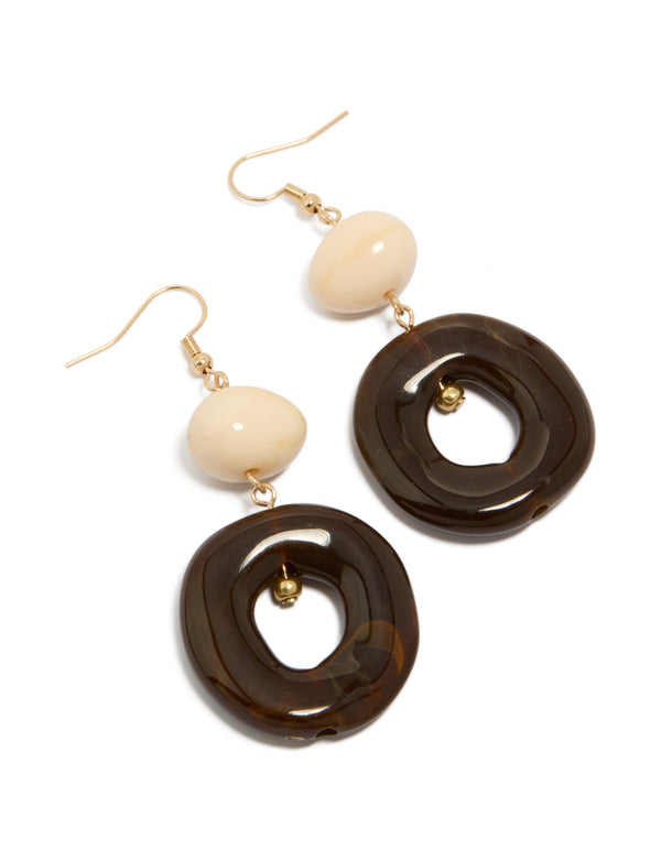Statement drop earrings featuring chocolate, cream, and gold acrylic circles front view