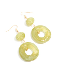 Showcasing gold green acrylic circle drop earrings front view - link has visual effect only