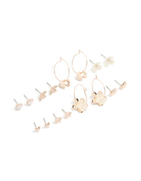 Discover rose gold pearlised flower and bee earrings 8-pack featuring motifs with bow, butterfly and pearl accents in ivory tones, stud and huggie closures front view - link has visual effect only