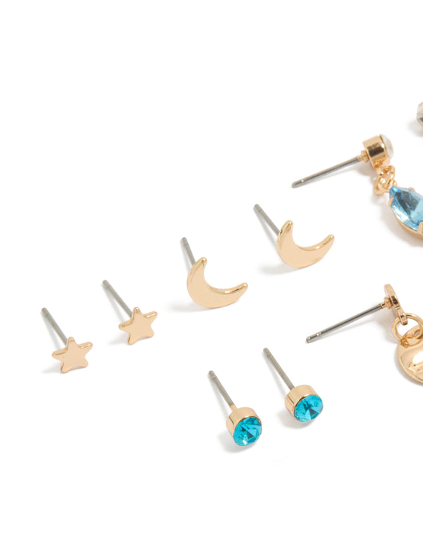 Beautifully crafted blue diamante celestial earrings showcasing disc, star, and moon in gold in close up view
