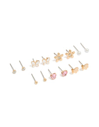 Discover this butterfly and pearl stud earrings 7-pack featuring in enamel with gold, white, light pink, and clear tones front view - link has visual effect only