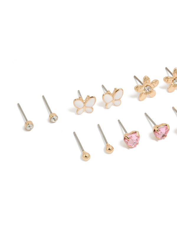 Explore this butterfly and pearl stud earrings 7-pack with floral enamel designs in gold, white, light pink, and clear close up view