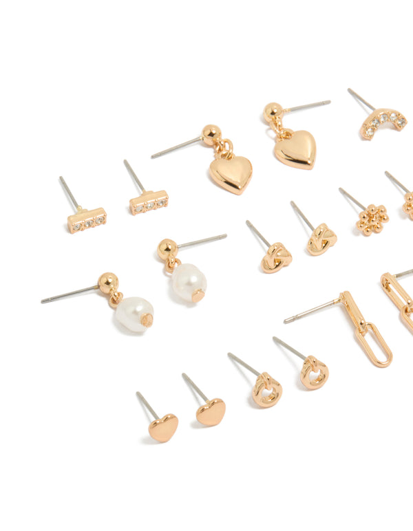 Showcasing gold mixed diamante stud earrings 12 pack with bar,heart, pearl and star designs and stud closure close up view
