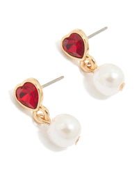 Showcasing gold stud earrings featuring red diamante heart with white pearl drop front view - link has visual effect only