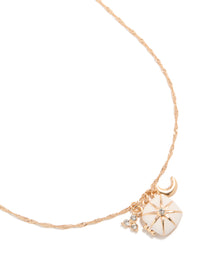 Discover a celestial charm locket necklace featuring moon and star accents in gold close up view - link has visual effect only