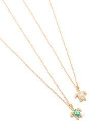 Beautifully crafted turtle pendant necklaces in a 2-pack featuring with ocean-inspired details in gold, green, and white close up view - link has visual effect only