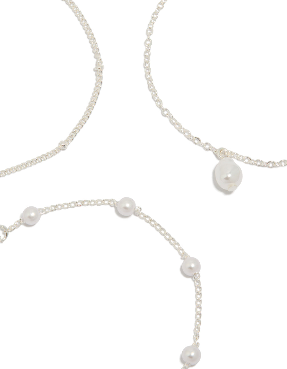 Detailed silver pearl, ball and station drop bracelets in a 3-pack close up view
