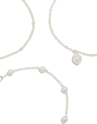 Detailed silver pearl, ball and station drop bracelets in a 3-pack close up view - link has visual effect only