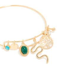 Crafted with gold snake and tree of life charm bangle featuring opal accents close up view - link has visual effect only