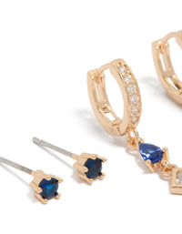 Showcasing crystal and cubic zirconia details in huggie and stud closures, this 2-pack set highlights gold tones with royal blue and clear stones close up view - link has visual effect only
