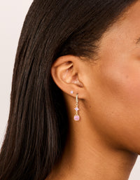 Showcasing gold pink cubic zirconia stud and huggie earrings 2-pack with charm details and crystal accents on ear view - link has visual effect only