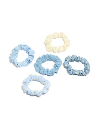 Showcase featuring daisy flower and checkered fabric scrunchies in a 5-pack with light blue, ivory, white front view - link has visual effect only