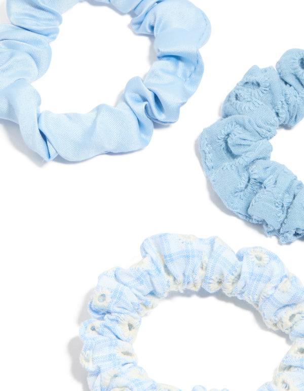 Featuring daisy flower and checkered fabric scrunchies in a 5-pack with light blue, ivory, white detail view