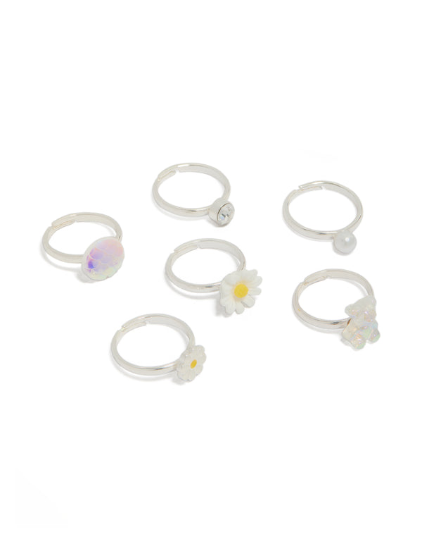 Showcasing a 6-pack of kids' silver-plated rings featuring animal, bear and daisy - floral designs with glitter, pearl, and enamel accents in white, yellow, and lavender, front view