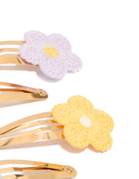 Featuring kids pastel crochet flower snap clips in a 4-pack, with floral design crafted from gold plated material in pink, lavender, yellow, and light blue side view - link has visual effect only