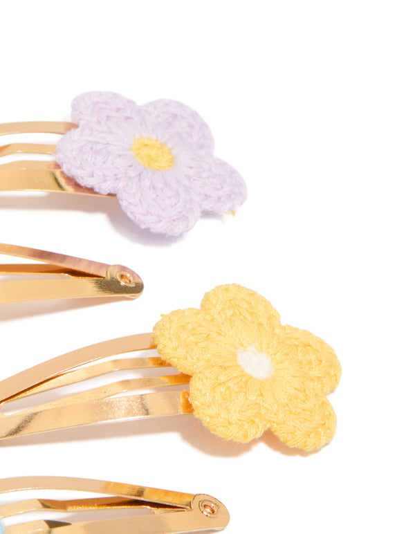 Featuring kids pastel crochet flower snap clips in a 4-pack, with floral design crafted from gold plated material in pink, lavender, yellow, and light blue side view