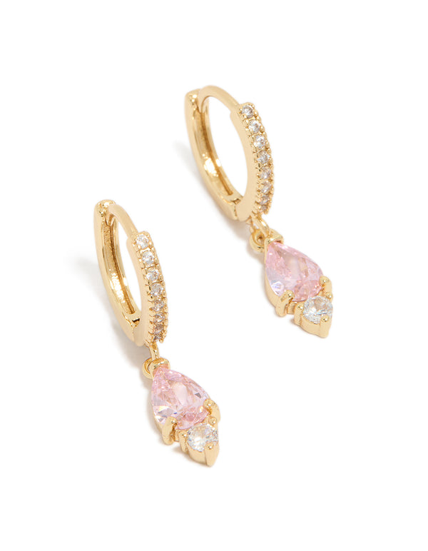 Showcasing dainty huggie earrings with pink cubic zirconia, gold plated finish front view