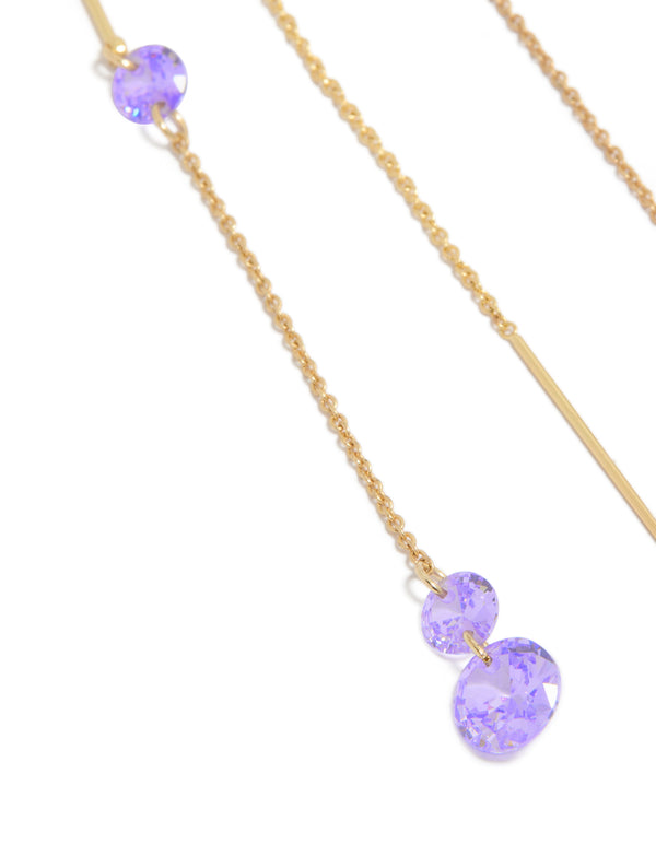 Highlighting the intricate detail of purple cubic zirconia stone settings on gold plated chain close up view