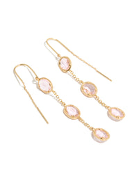 Showcasing statement earrings crafted from gold plated material with oval cut pink diamantes in a thread through design front view - link has visual effect only