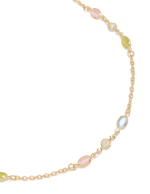 Showcasing a gold plated pink blue and green cubic zirconia ovals necklace with oval stone cut in statement style close up view